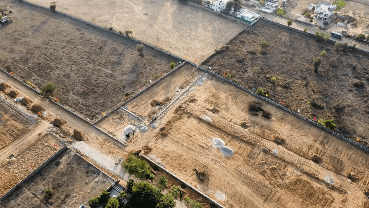 Mid-range aerial view of plotted township on Ajmer Road–Ring Road growth corridor, Jaipur