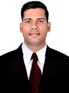 A businessman wearing a white shirt with tie and a black coat making the wearing a proper suit