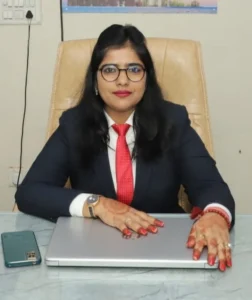 A busniess woman sitting in her office chair facing forward towards camera